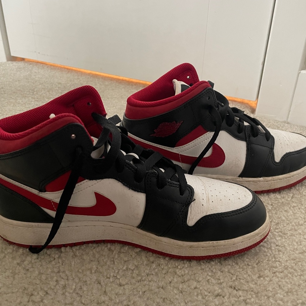 Black and red Nike Jordan’s